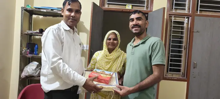 Property document handover moment with a happy family